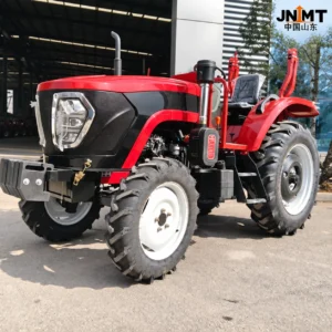 Red Zhongtuo 904 tractor outside a workshop, front three-quarter view
